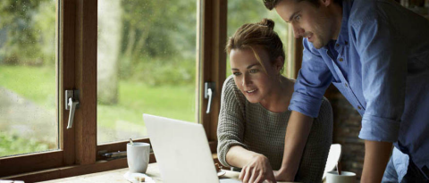 A couple collaborating to build their emergency fund